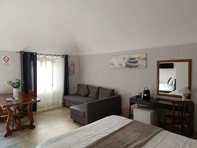 General view: sofa, table and desk - Room 1A - Casa Ena
